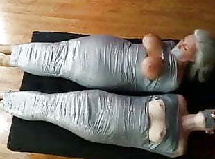 Two girls mummy taped and vibed