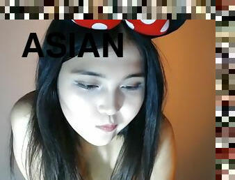 Cute asian tiny girl naked and with a bow on her head