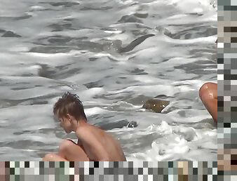 Voyeur films nude ladies on the beach