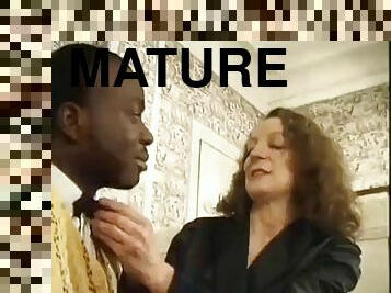 Elegant mature fucks a black man