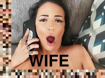 A slutty wife talks to her husband on the phone while giving a blowjob