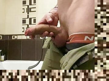 Russian guy masturbates his big dick in the bathroom and plays with balls