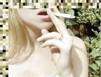 Blonde teen is smoking and spitting loogies coughing hocking phlegm with long tongue