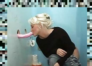 Dildo comes through the gloryhole