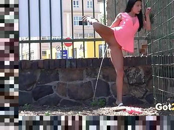 Slutty outfit on this hottie pissing outdoors