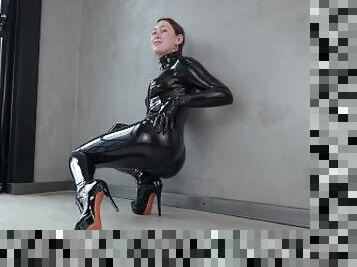 latex model showing off her favourite catsuit. filmed by reflective desire