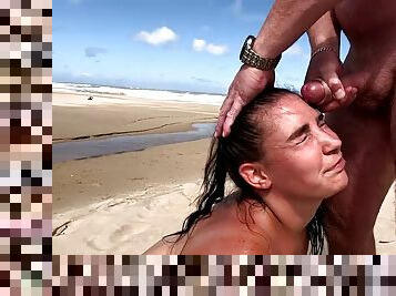 Slut giving blowjob and handjob on the beach, facial cumshot