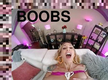 Inked up blonde with huge tits gets off with her toys in VR
