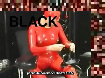 Hot girl full encased in red rubber suit enjoys gas mask breathplay in her black room