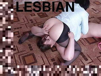 Lesbians lick pussy to each other in a pose 69.