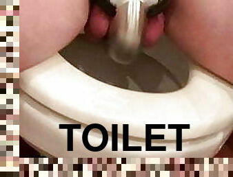 Slave in chastity on the toilet