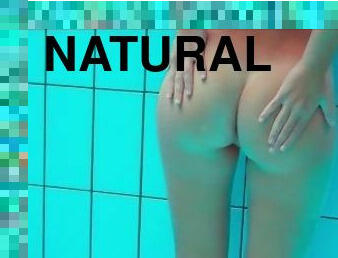 Brunette Nata Szilva strips underwater and gets horny