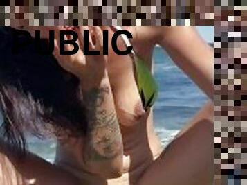 Sweet Lola fingers herself public at the beach