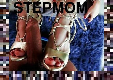 Sexy stepmom wearing golden heels gives me a footjob