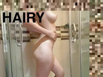 Girl taking a shower and washing her hairy pussy Solo