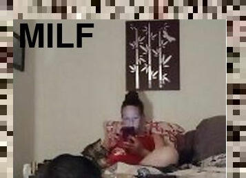 White milf smoking while watching videos on her phone