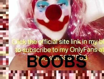 Sexy clown shows off huge tits on slide show