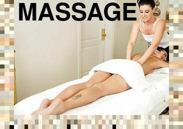 India Summer and Kiarra Kai licking each other on the massage table