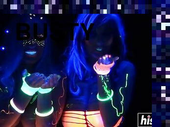 Busty girls are playing with fluorescen paint and a few dildos