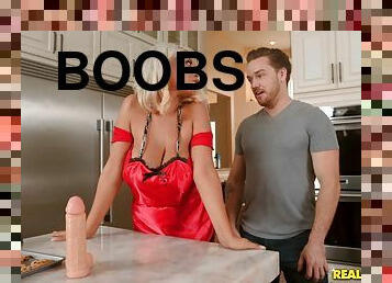 Curvy blonde with huge boobs blows dick while baking bread