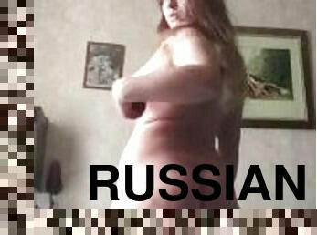 Russian beauty has fun with a red phallus