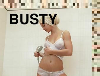 Busty blonde teen masturbates in the bath