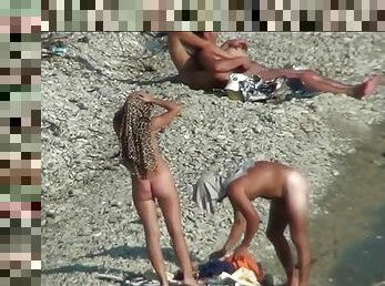 Beach babe sucks her man and her rides