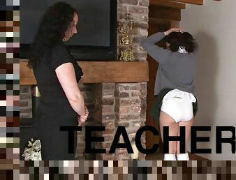 Teacher hairbrushes student's ass