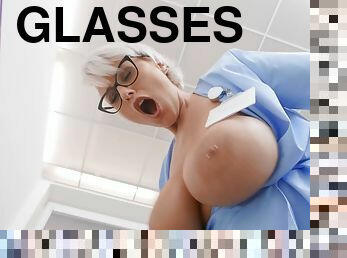 Short-haired nurse in glasses fucks young Spanish dude