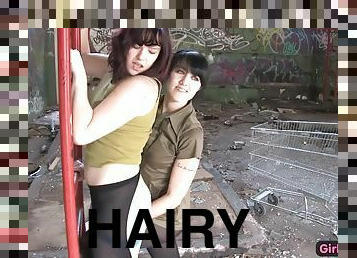 Cute hairy lesbian fucked with a strapon