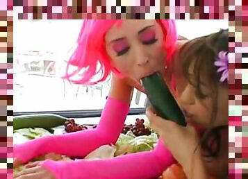 Young chick is sucking her lovely dildos