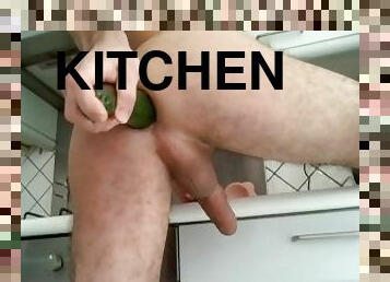 Practice with a large zucchini in the kitchen