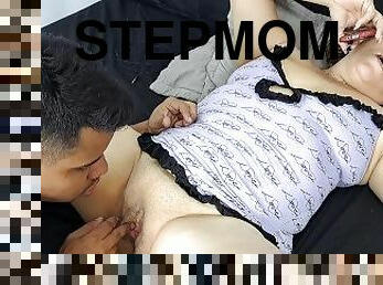 I suck my stepmom's pussy while she talks on the phone