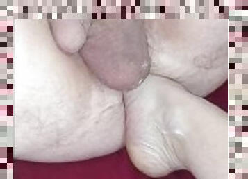 Foot in husband's ass