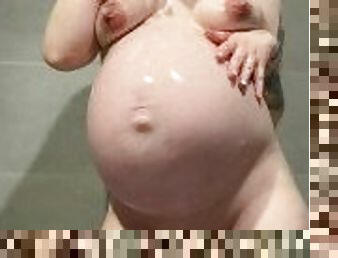 9 month pregnant woman masturbates in the shower