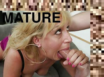 Mature enjoys young meat between her slutty lips