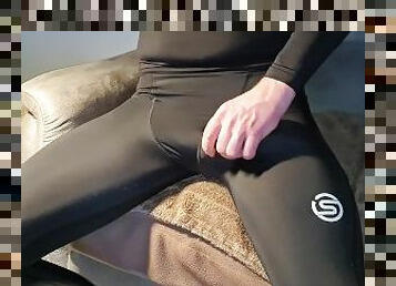 Big cum spurt on shiny spandex legs