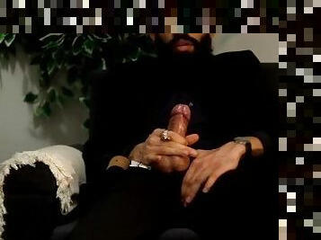 Daddy in a black suit smoking, stroking his big cock and moaning