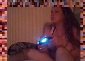 Lonely Milf With Long Brunette Hair and Big Boobs Smoking Cigarettes and Playing Video Games