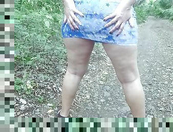 Walking and pissing in short dress outdoors