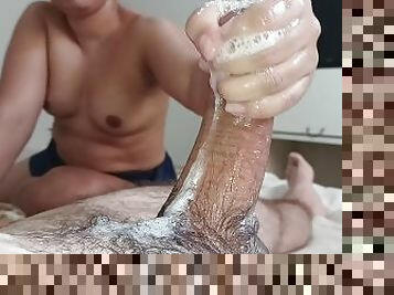 handjob with both hands playing with a lot of spit until he deliciously ejaculates his big dick????????