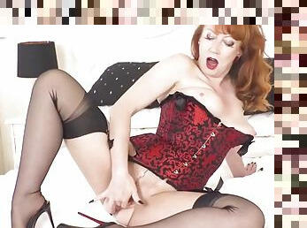Redhead milf fingers throbbing pussy in corset nylons heels