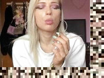 sexy blonde high school girl smokes a cigarette